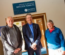 Chris Chambers presents signs as part of new Matlock Town FCs sponsorship